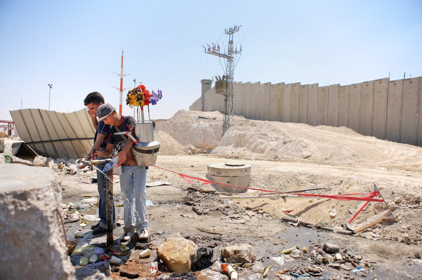 <i>Distributing Water at the Qalandia Checkpoint</i>, West Bank, 2005